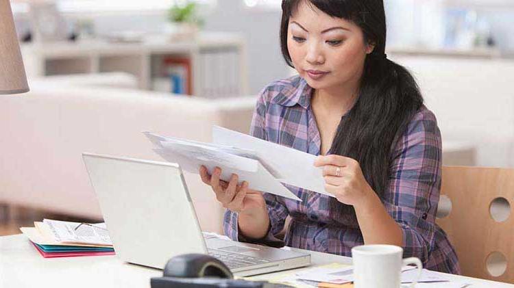 Woman going through papers.